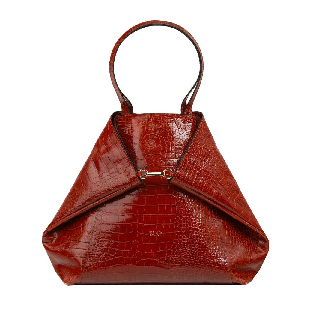 Brown crocodile-patterned handbag on a white background