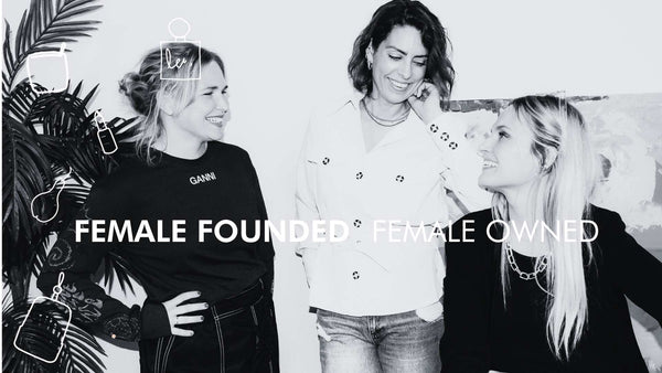 3 women laughing together with the text "female founded, female owned" written