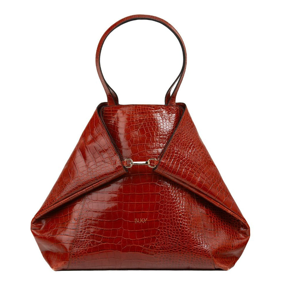 Brown crocodile-patterned handbag on a white background